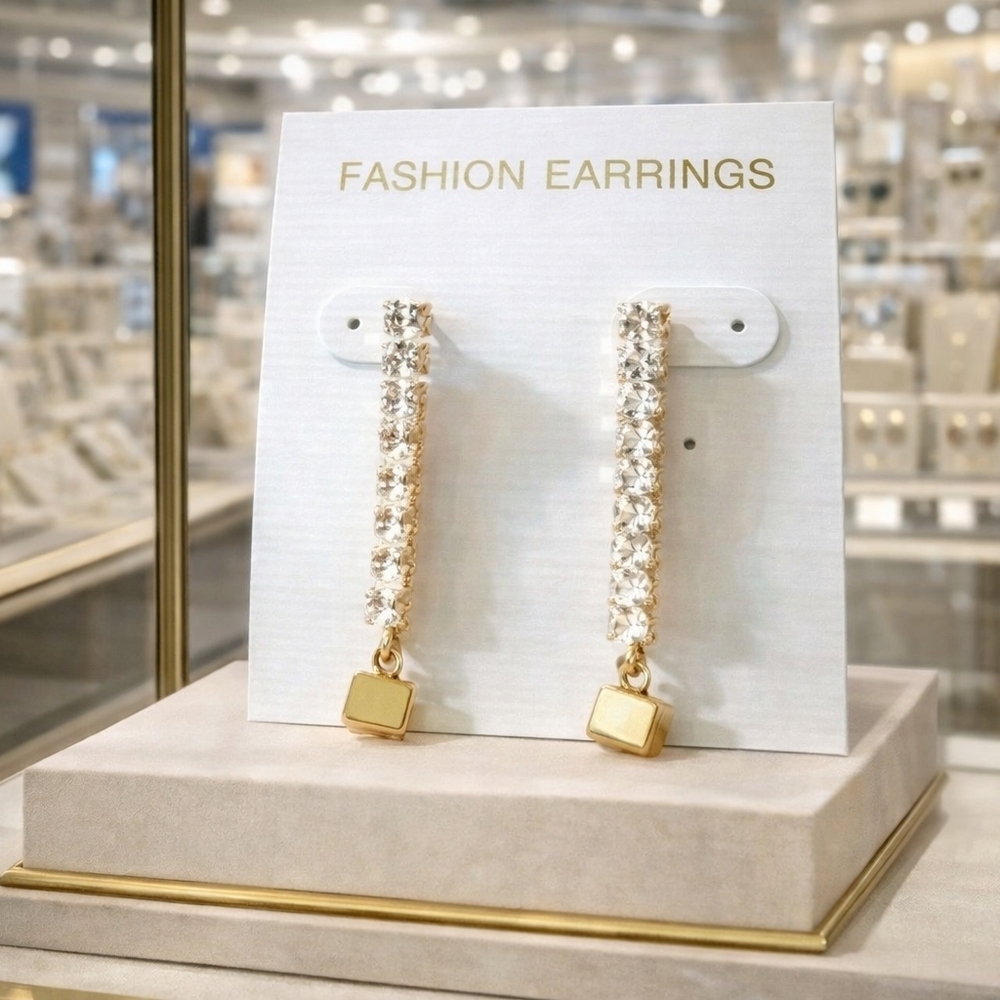 Women's rhinestone and gold earrings